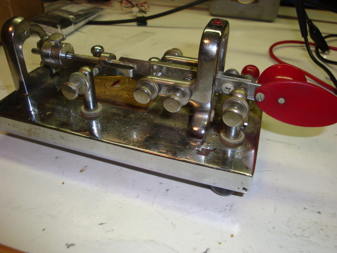 Vintage chrome Morse telegraph key with red paddles