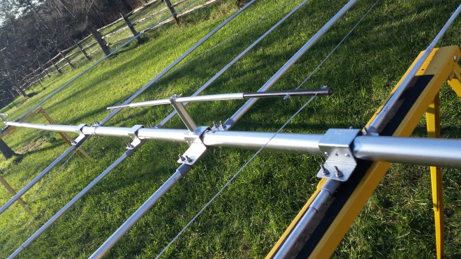 Metal antenna array on grassy field