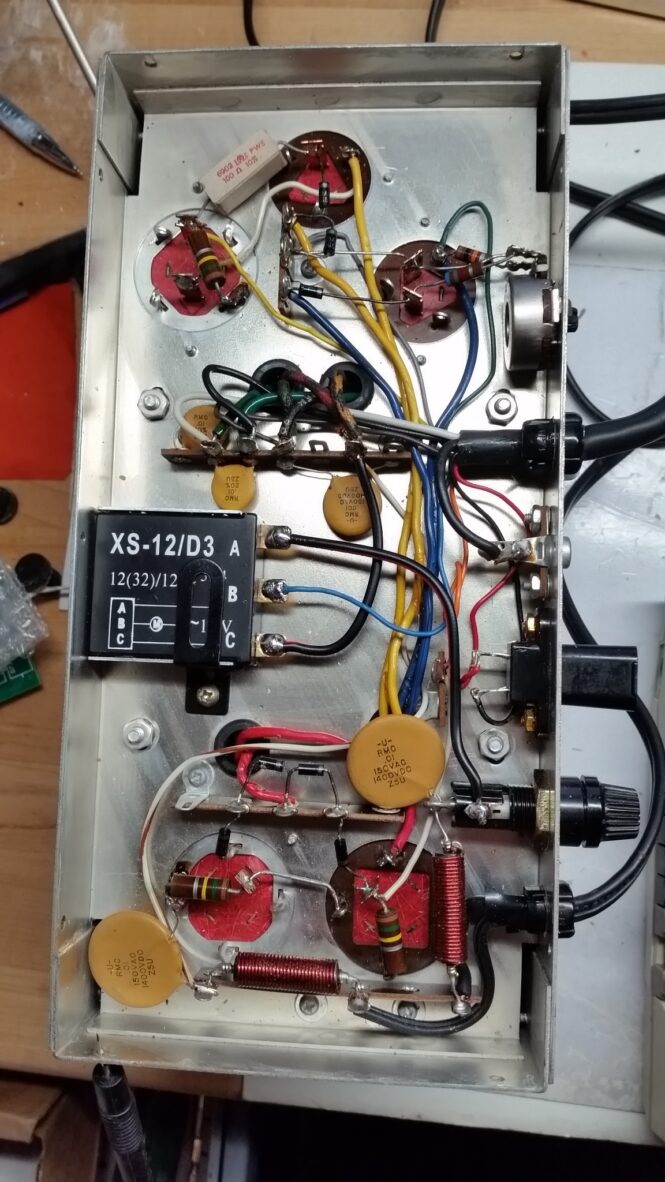 Open electronics chassis showing wiring and components