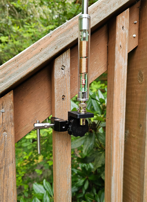 Antenna mounted on wooden deck railing