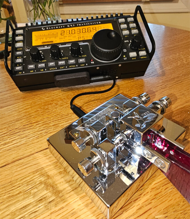 Ham radio transceiver with chrome Morse key